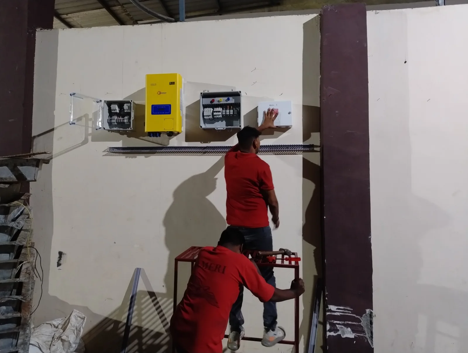 Solar installation workers wearing safety helmets